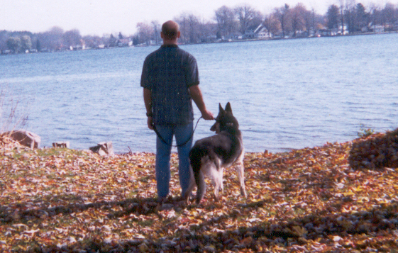 Person with Dog at Lake Person with Dog at Lake